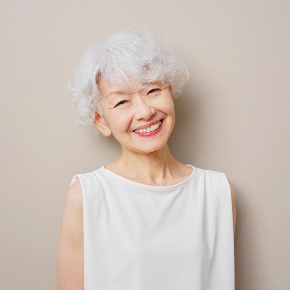 Portrait of Asian senior woman in beige background