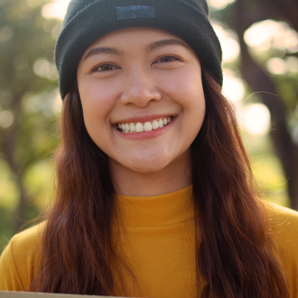 Go green culture Gen z asia people young adult woman curly hair enjoy cheerful relax toothy smile happy face looking at camera nature tree public park save the earth eco friendly city life future hope