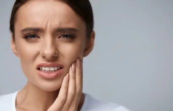 A woman with a toothache.