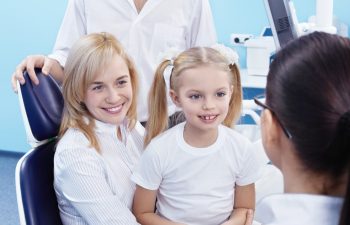 Young family with a child in the dental office